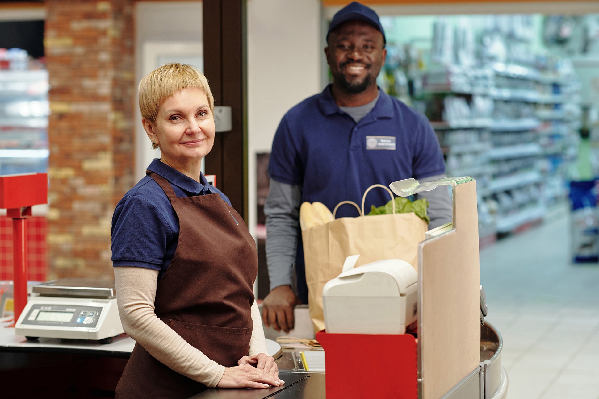 intercultural-staff-of-supermarket-in-uniform-stan-2023-11-27-05-23-13-utc.jpeg