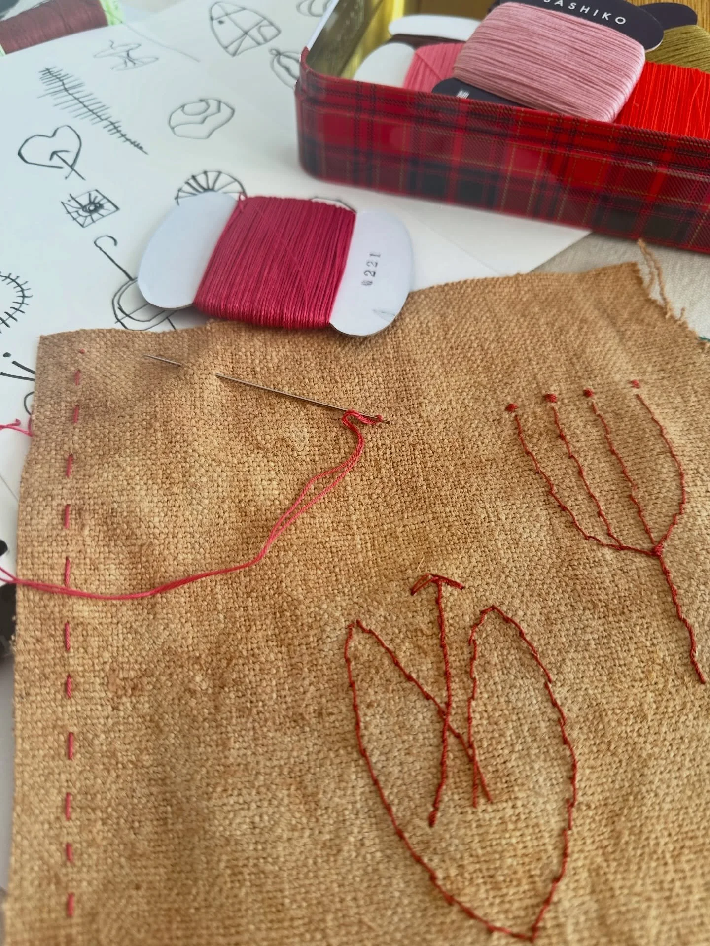 Building up my library of signs and symbols - red top stitch thread on some dyed homespun&hellip;#homespun#naturaldye#symbology#marksonpaper#handstitch