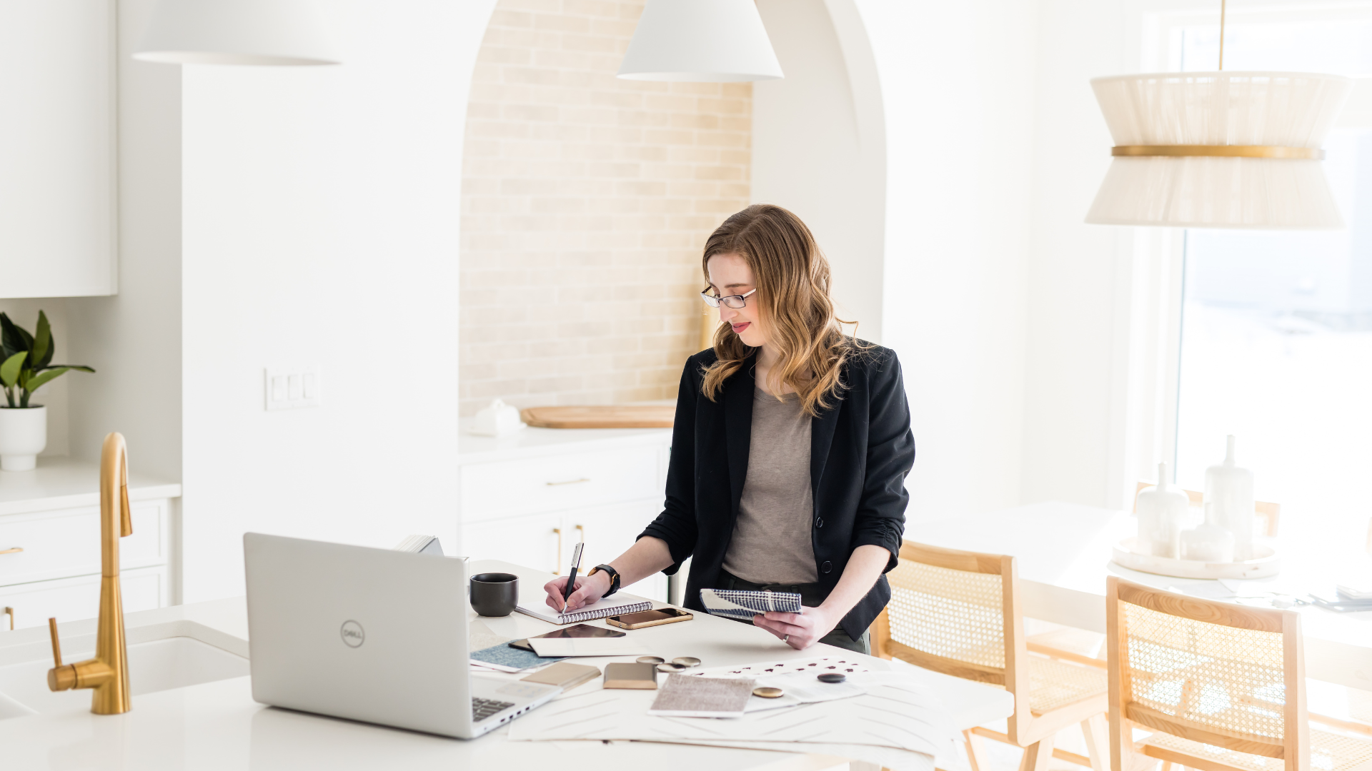 Interior designer managing finishes, samples, and design decisions as part of a full-service interior design process.