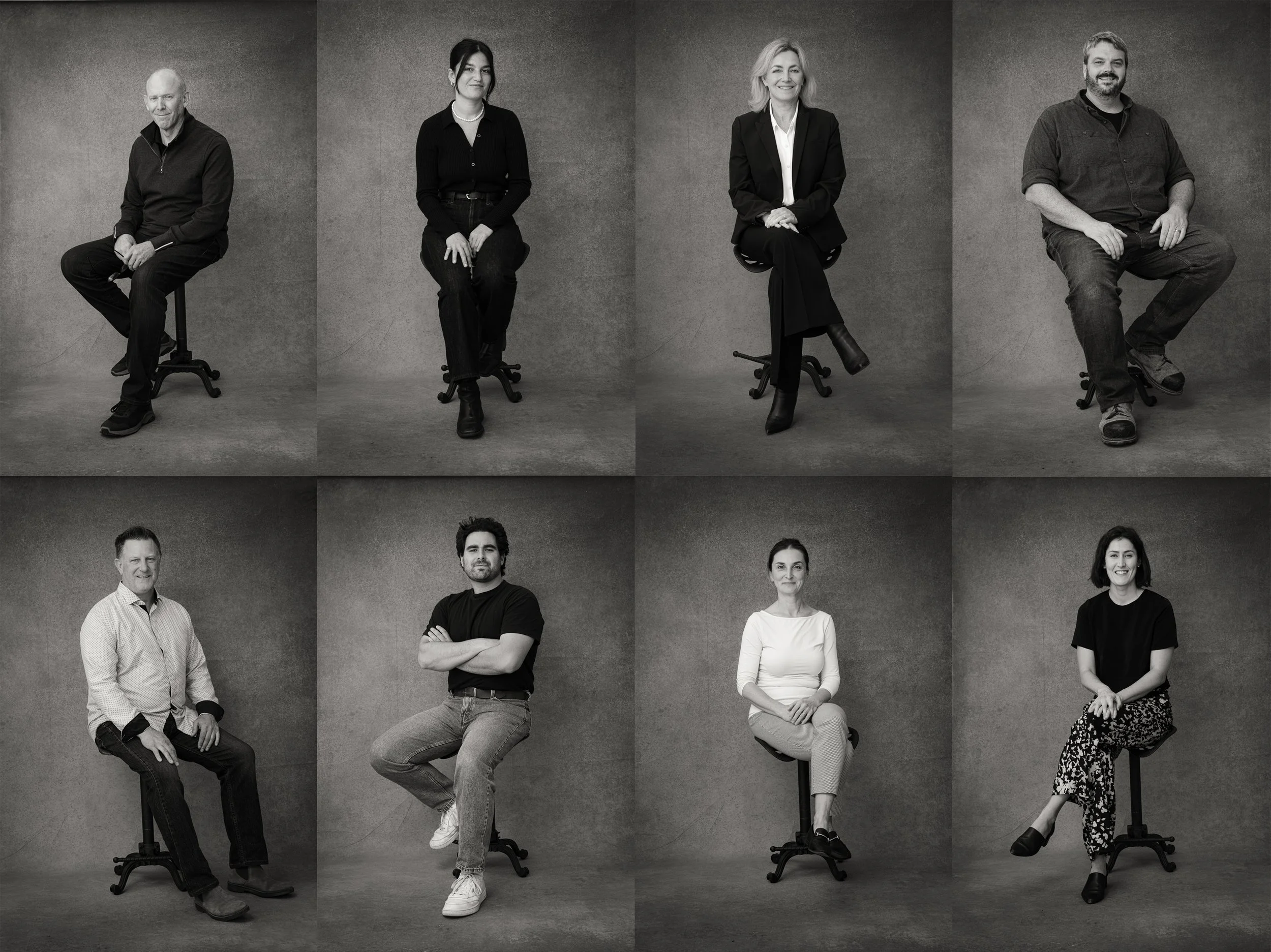 Featured image showing a grey hand-painted backdrop rental shot in black and white. The photoshoot features architect portraits and headshots for their website.  