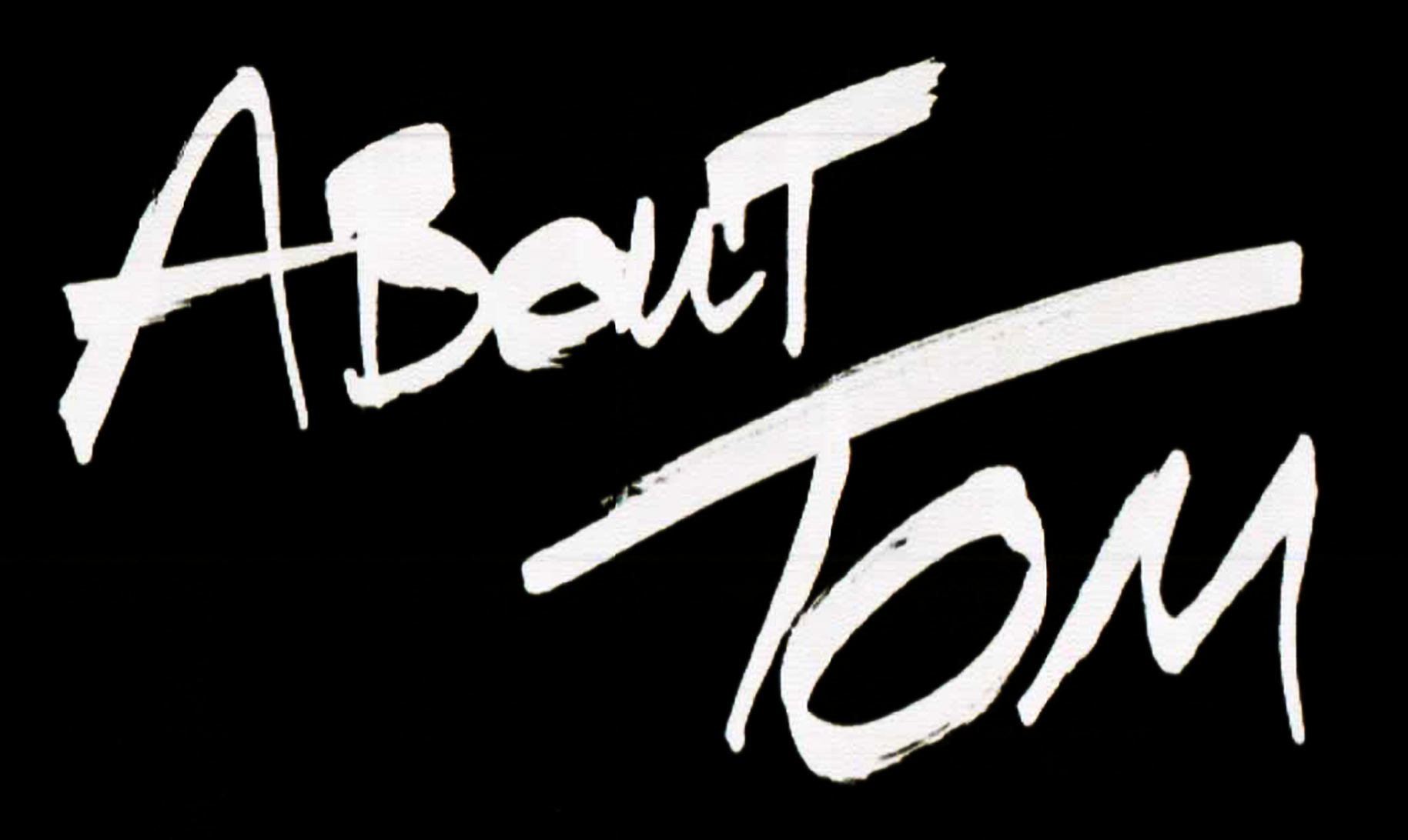 Close-up of white graffiti-style text on a black background.