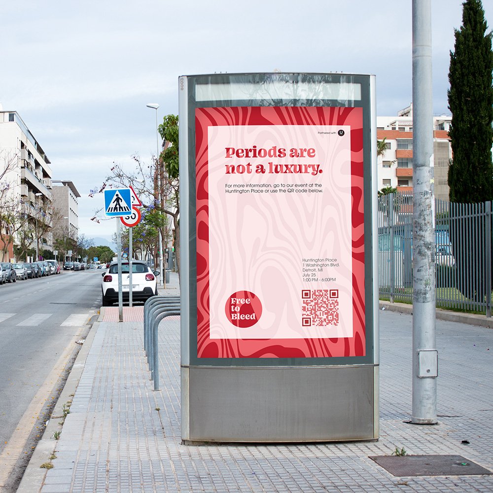 Street poster reading “Periods are not a luxury” with Free to Bleed logo and QR code.