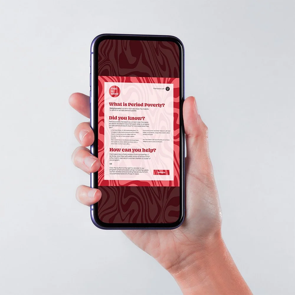 Hand holding a smartphone displaying a red and pink marbled "Free to Bleed" webpage about period poverty, with sections titled "What is Period Poverty?", "Did you know?", "How can you help?', and a red Donate button, against a neutral gray background