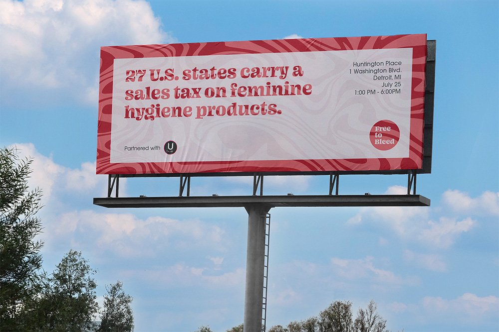 Billboard reading “27 U.S. states carry a sales tax on feminine hygiene products” with Free to Bleed branding.