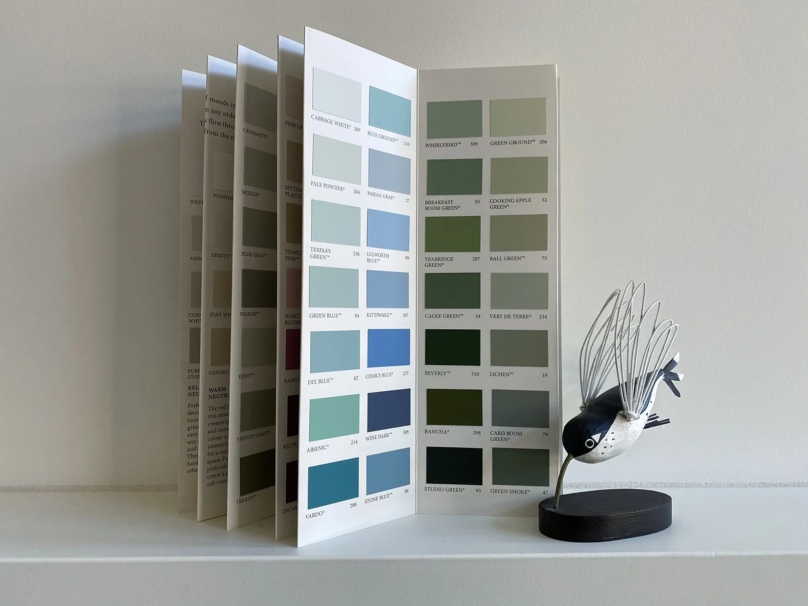 Farrow & Ball paint chart with model of a hummingbird