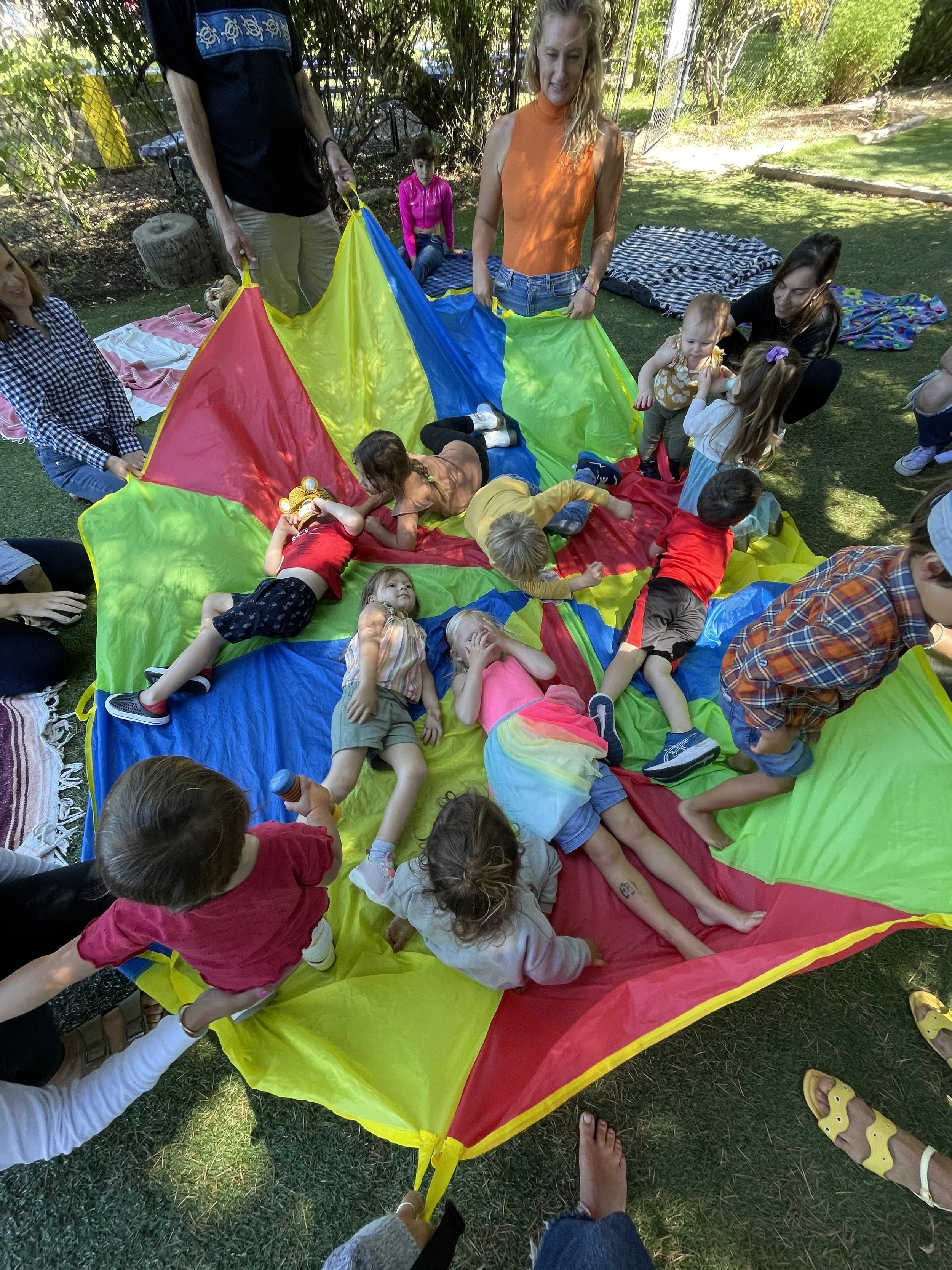Kids running around outdoors at Kathy's Music Moment