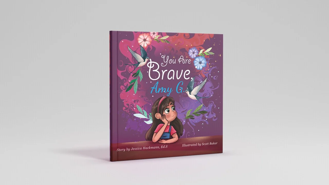 Children's book titled "You are Brave, Amy G." with a purple and pink background, illustrations of hummingbirds, flowers, and a girl with brown hair wearing pink and blue clothing, sitting with her head resting on her hand.