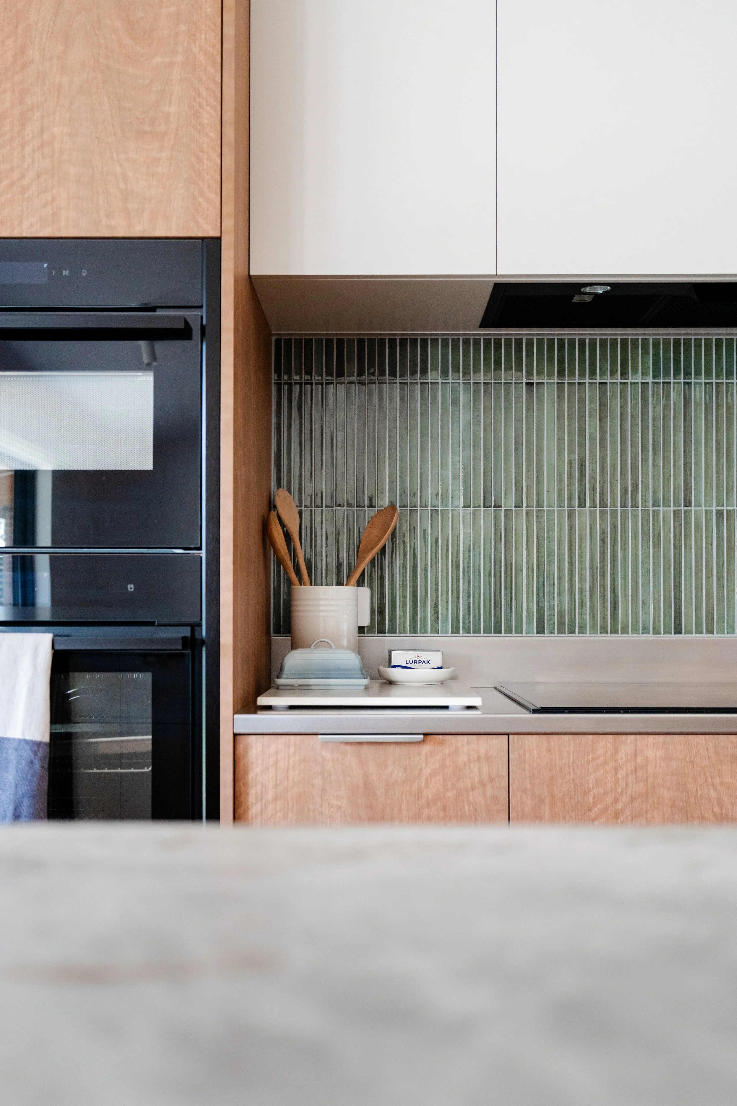 Laminex Spotted Gum Joinery, Stone Ambassador Taj Mahal Benchtop & Touch Ferrara Stainless Lip Handle