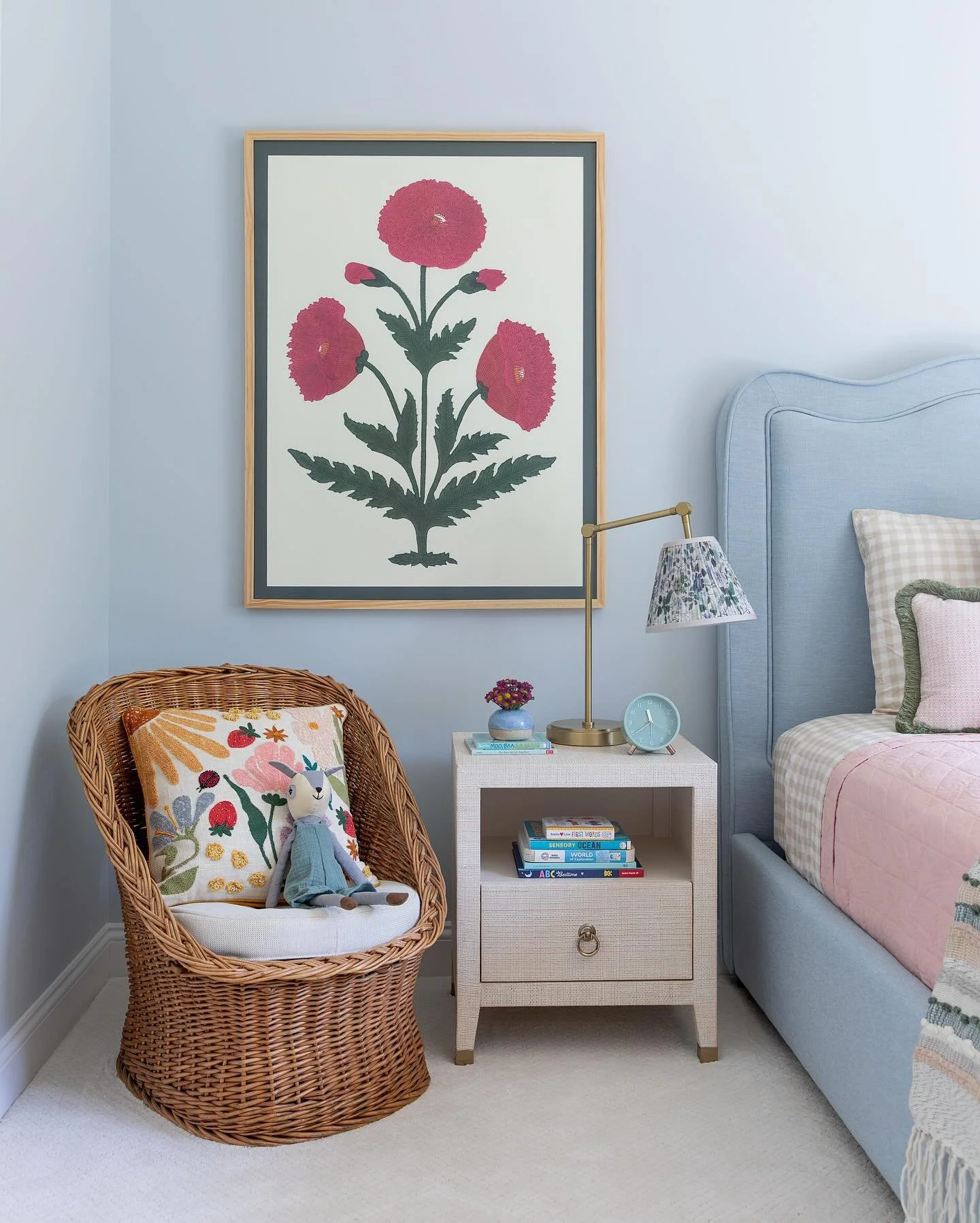Where sweet dreams bloom 🌸 This little girl&rsquo;s room is a garden of imagination &ndash; soft blue walls, cheerful pink accents, and vintage botanical artwork are playful but designed to grow with her. 

Photography: @katielouise.photo 
#girlsroo
