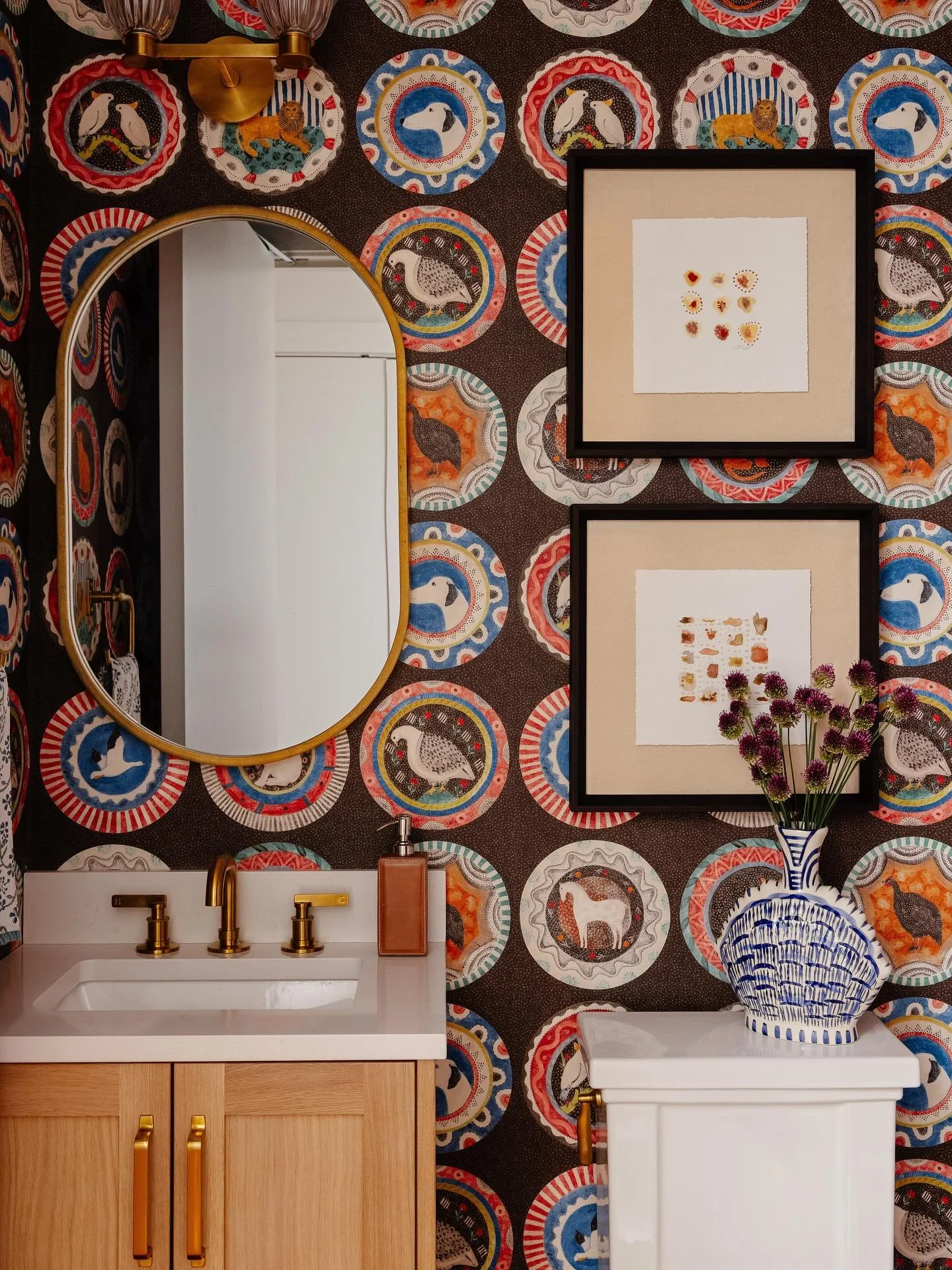For our client&rsquo;s Boston pied-&agrave;-terre, we transformed a small powder room into a jewel box of personality. The rich, chocolate-brown wallpaper celebrates her love of animals and brings a bit of her nature-filled Colorado surroundings into