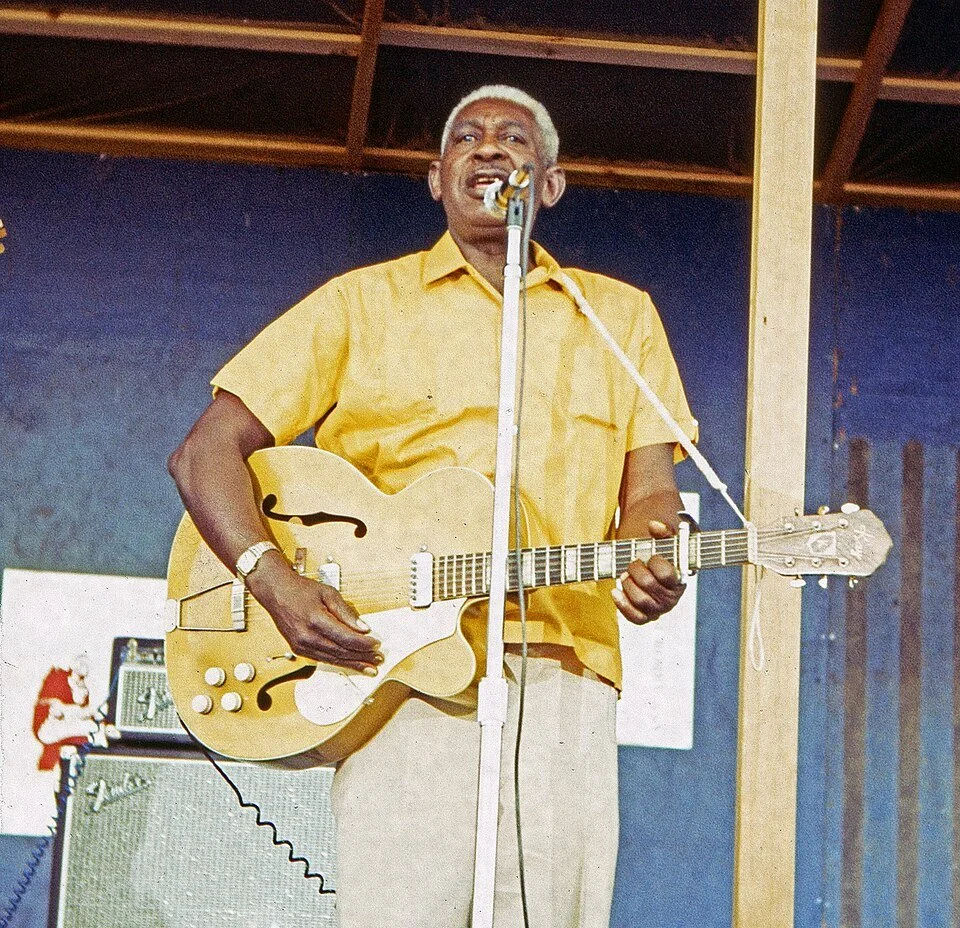A photograph of Arthur Crudup performing on stage in 1970
