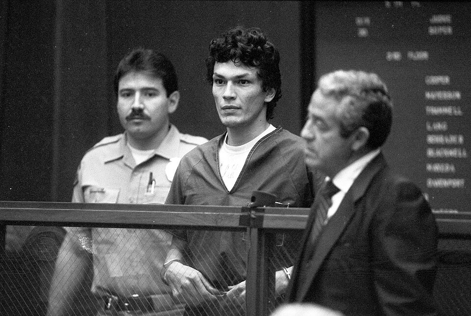 A photograph of Richard Ramirez handcuffed in court with his attorney