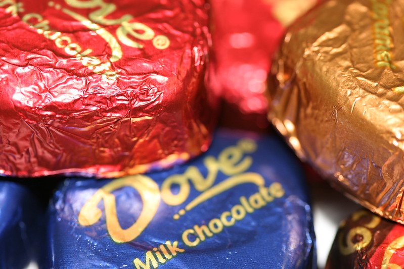 Several pieces of Dove chocolates in different color wrappers