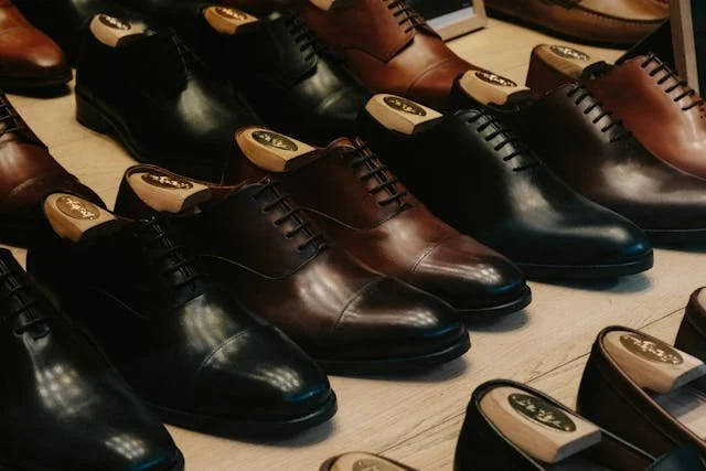 A photograph of several rows of new leather shoes