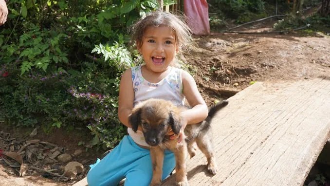 The puppy brings her kefi. She brings her puppy Kefi.