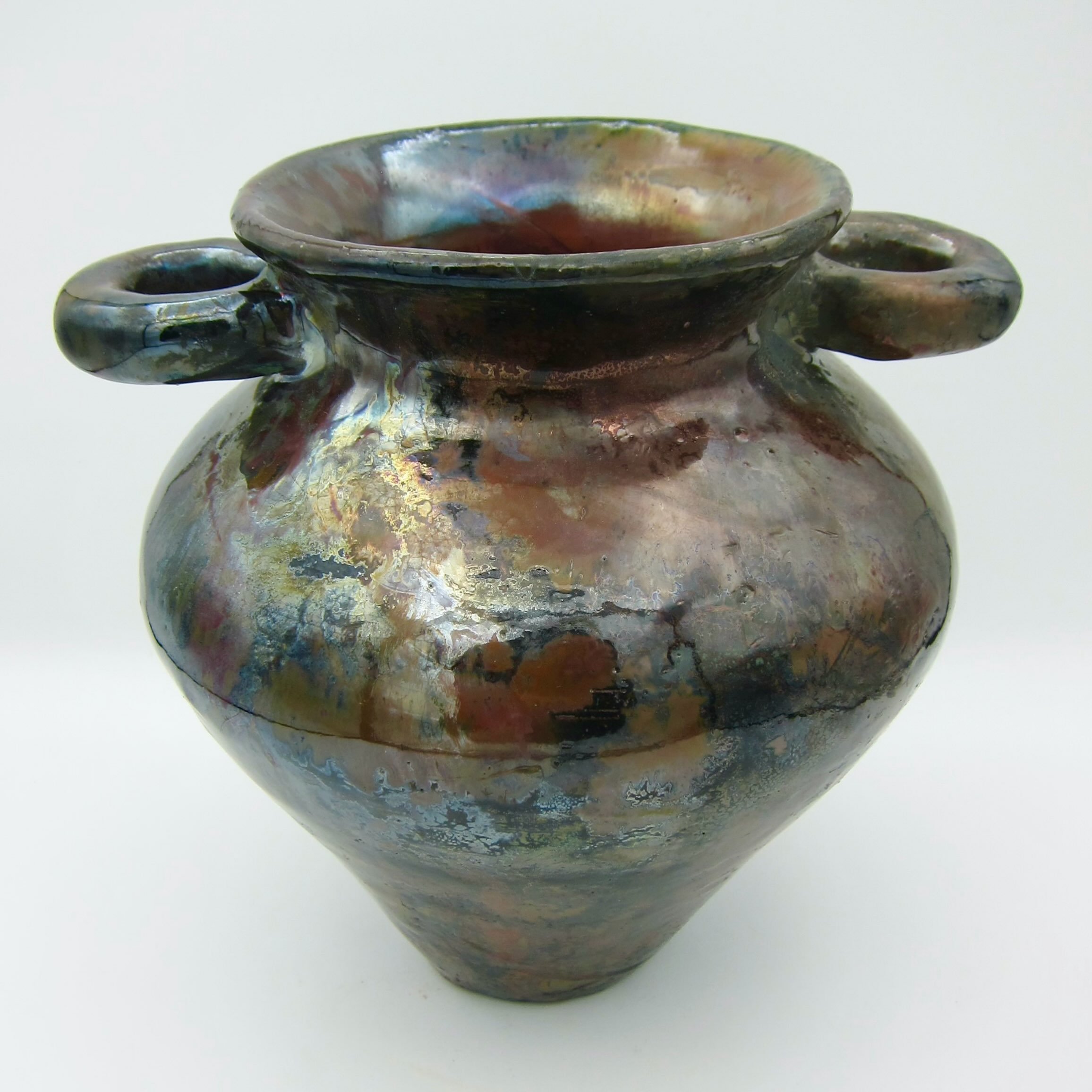 ✨ Raku ✨
I recently had the privilege of doing a raku firing, and here is one of the vases that came out of that :-)
