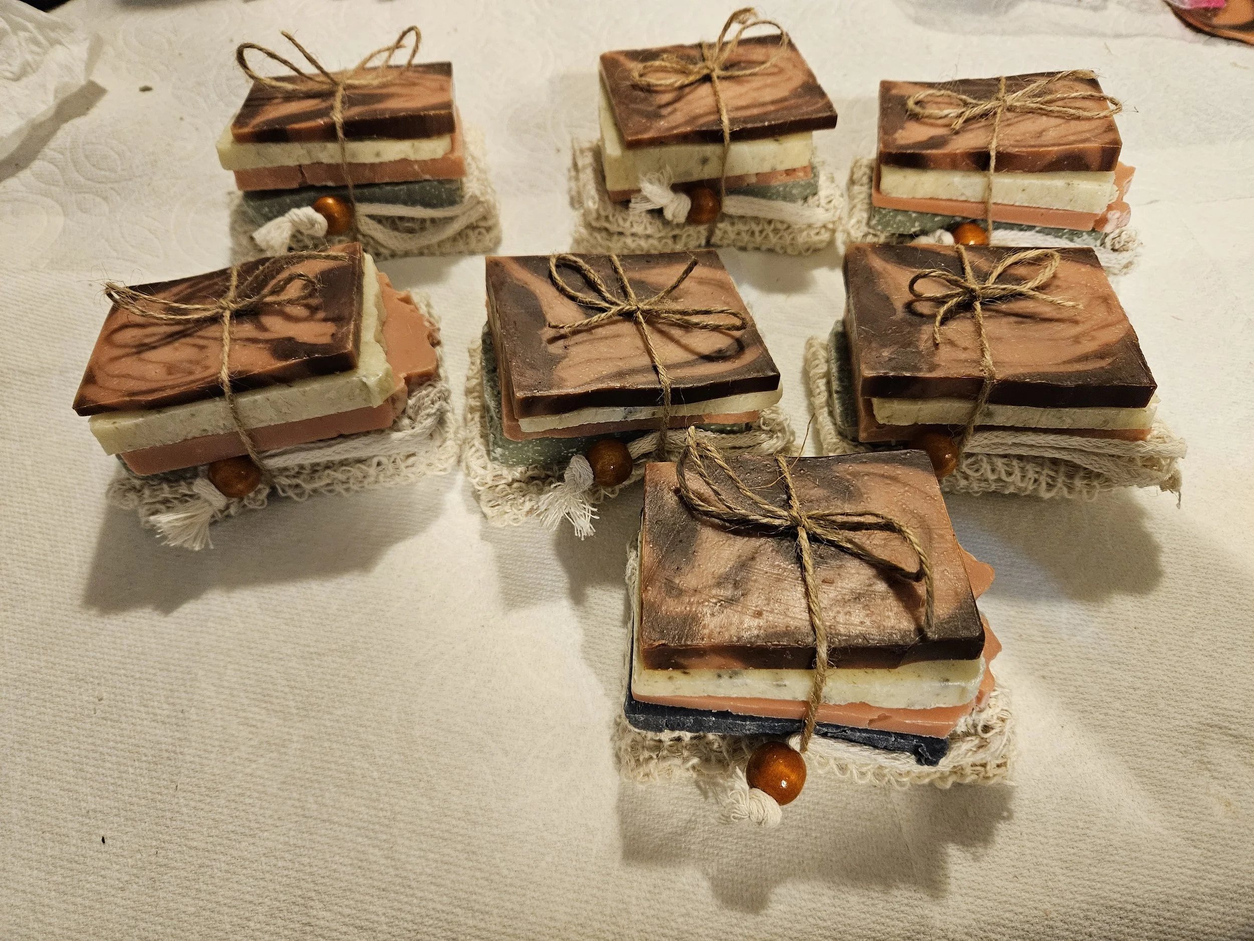 Handmade Natural soap bar samples and soap saver bag tied together with twine