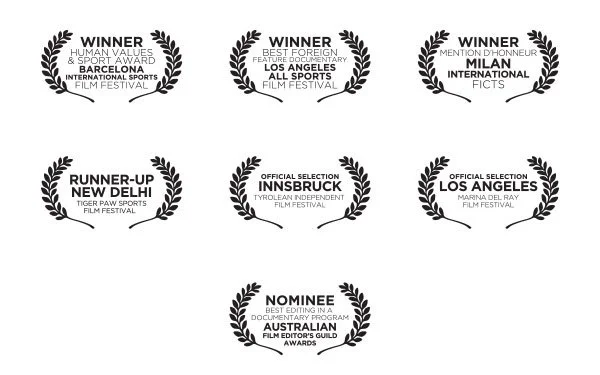 Various laurel wreaths with award titles and film festival names, including winners and nominees for international sports, foreign feature, and documentary awards.