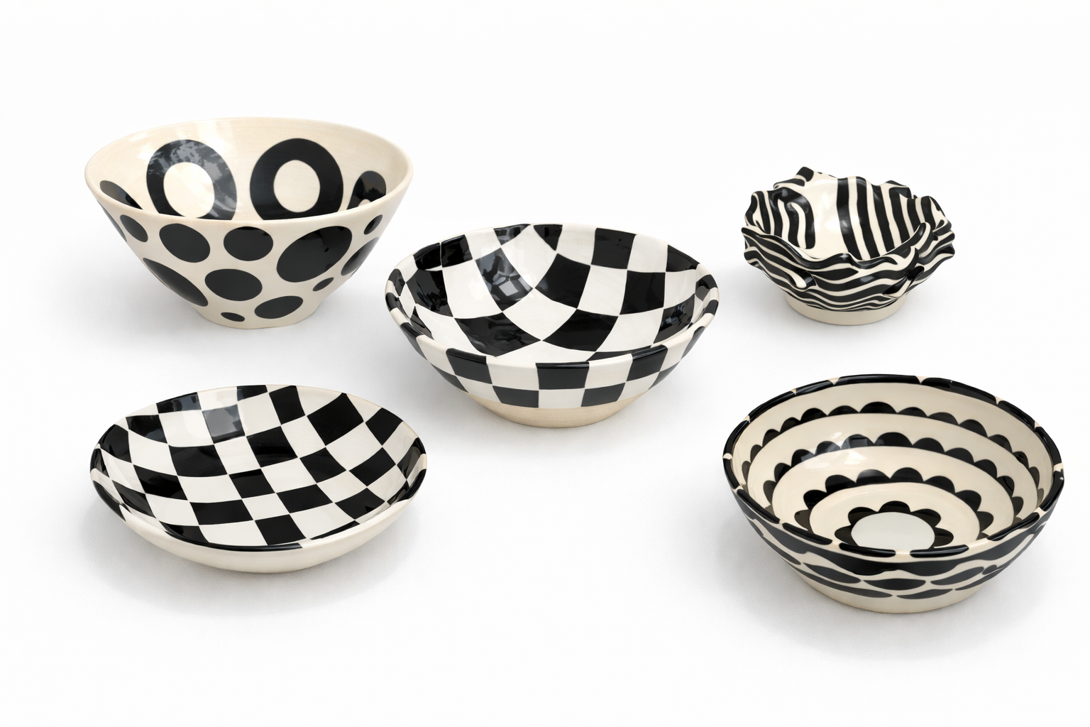 Six bols en céramique noire et blanche avec des motifs géométriques variés, disposés sur un fond blanc.