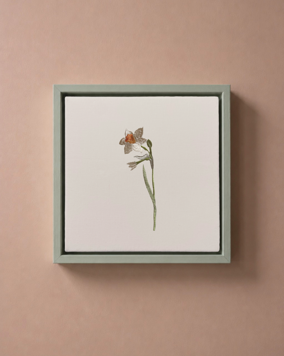 Narcissus December birth flower canvas featuring botanical embroidery in a sage green frame.