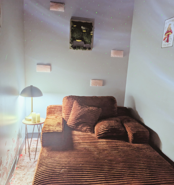 cozy soft chaise inside a small room with lamp