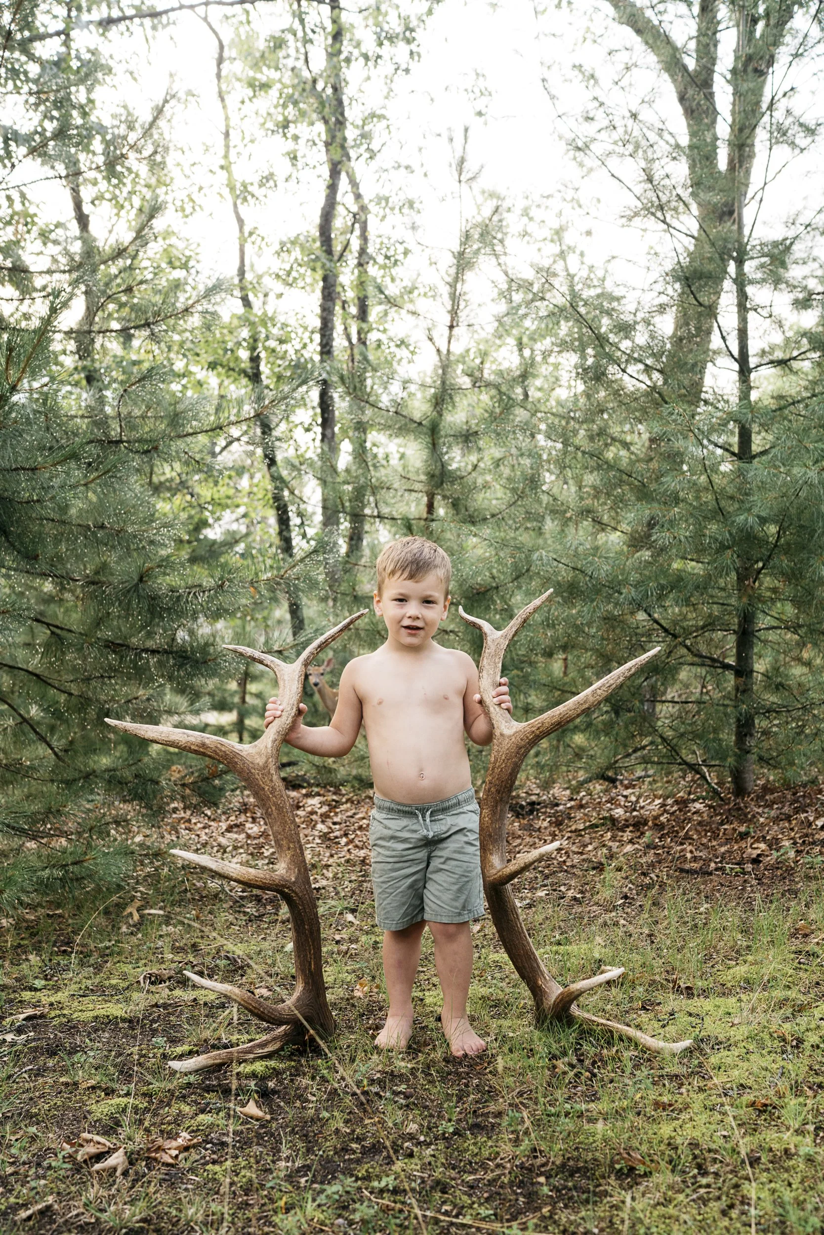 little boy with elk antlers
