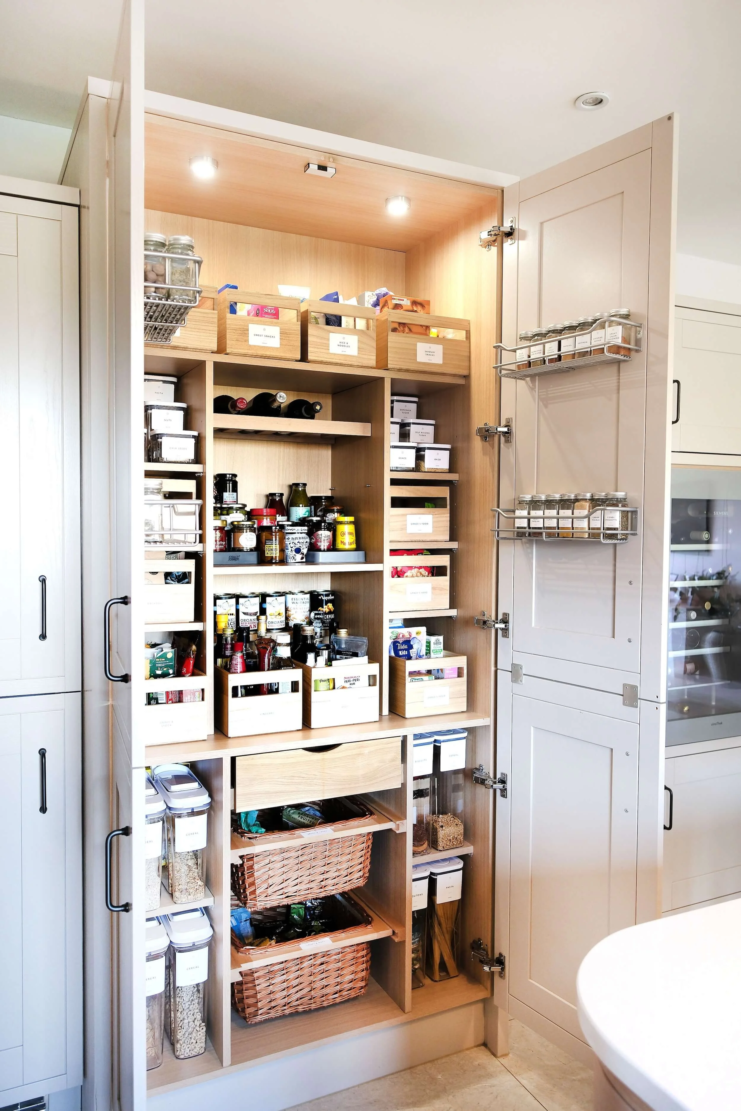 An organised pantry in a kitchen.