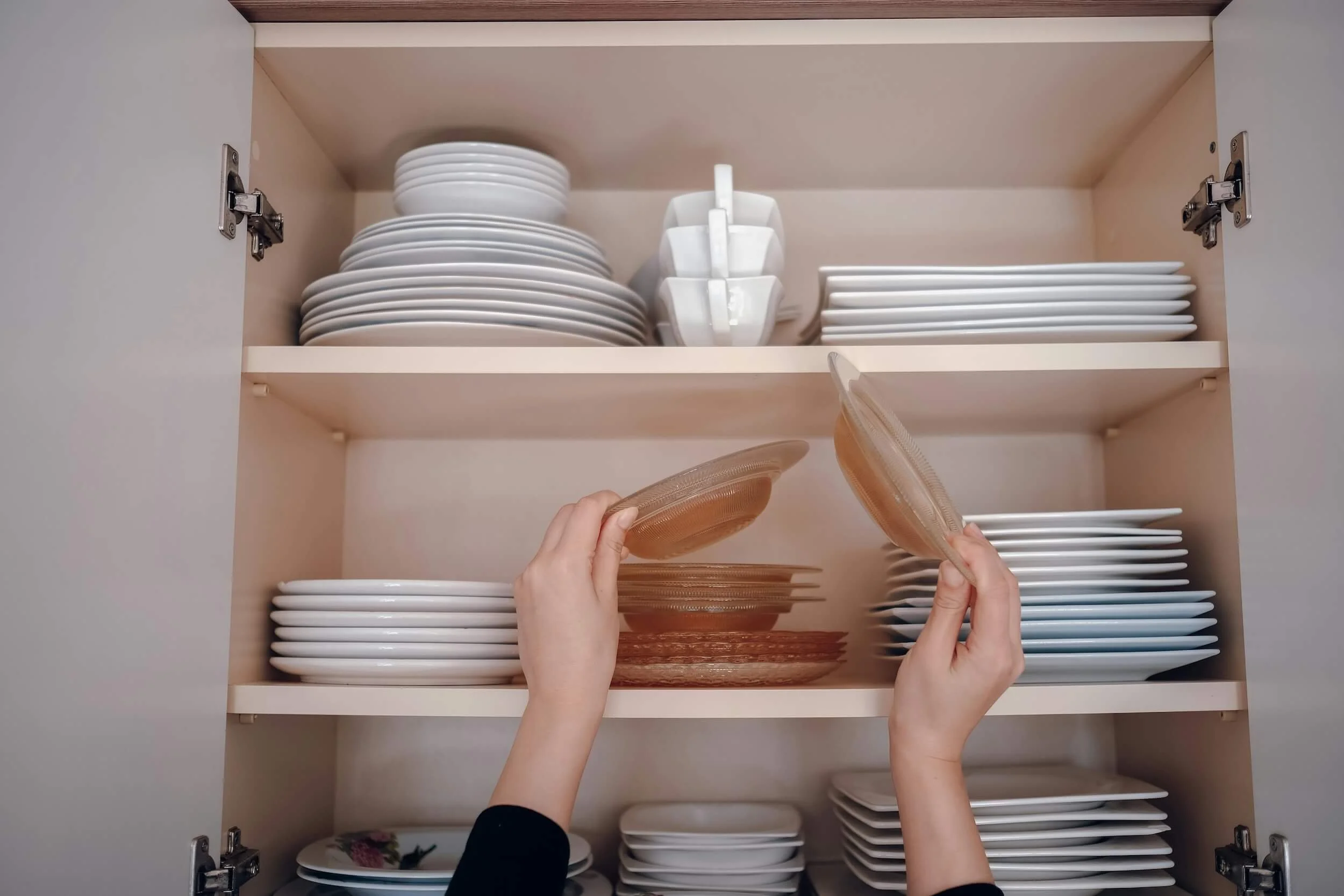 Woman organising a shelf