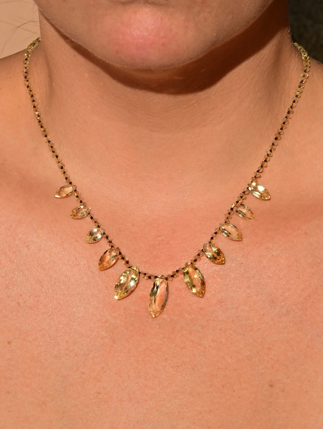 New! Meet Marquesa. 

Marquesa takes her name from the marquise cut, but she&rsquo;s anything but ordinary. Eleven golden citrines, hand-knotted on warm brown thread, flow in a rhythm that feels both bold and free. Wear her your way, effortless for e