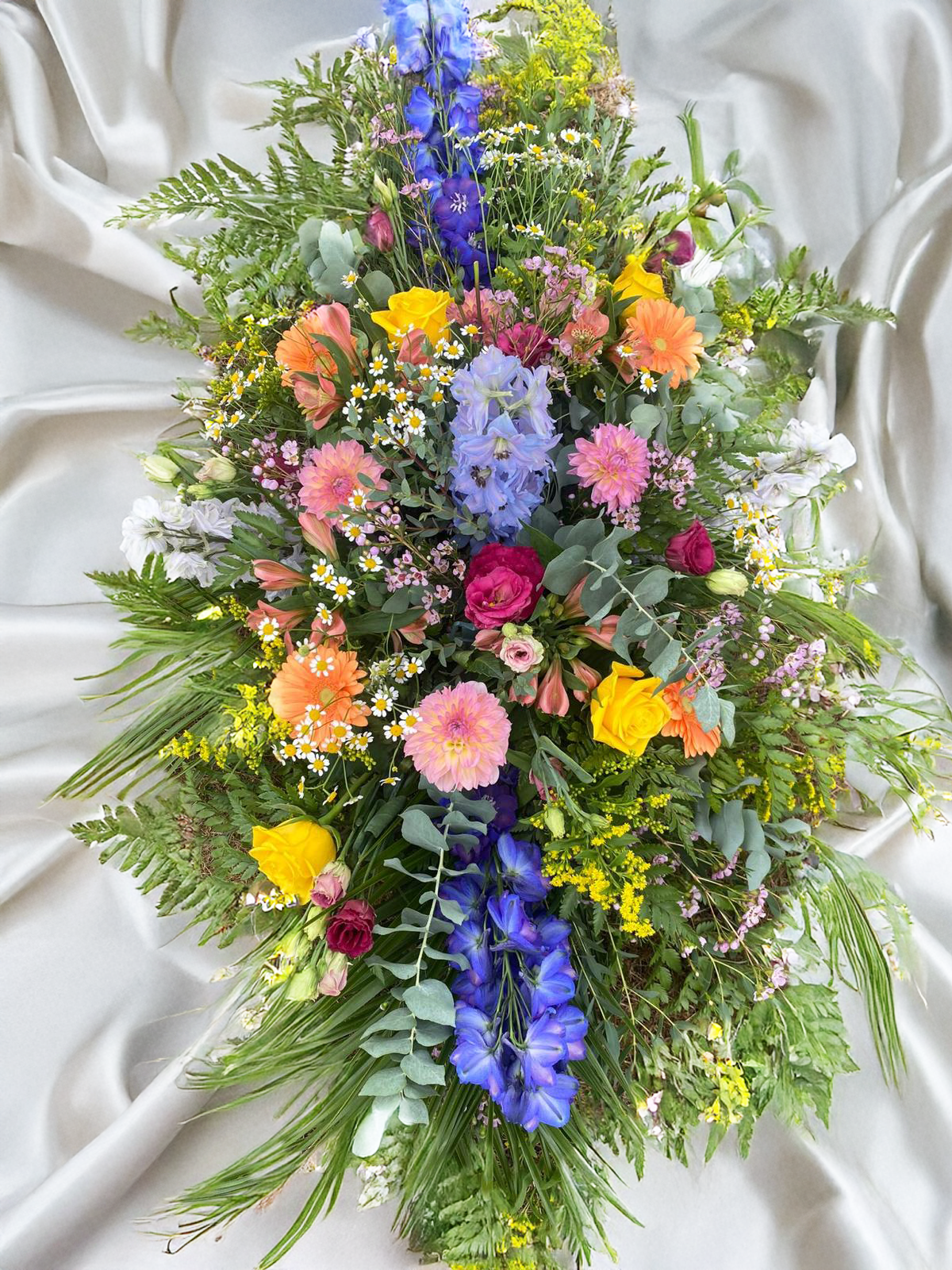 'JOYFUL REFLECTION' CASKET SPRAY