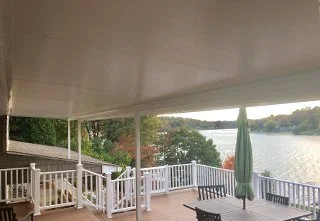 Deck Cover over a deck facing a lake.