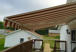 A sea-wave retractable awning covering a porch.
