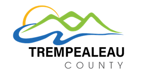 Stylized graphic of a mountain, river, and tree in green, blue, and yellow, with the word 'County' beneath.