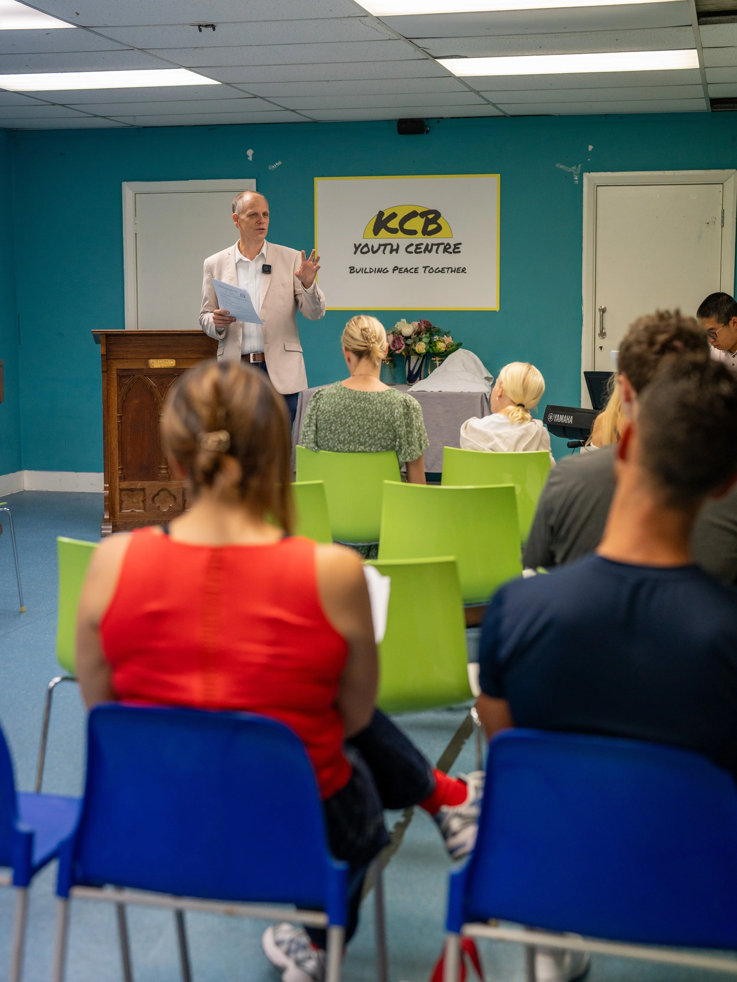Minister speaking to the congregation at King’s Cross Neighbourhood Centre