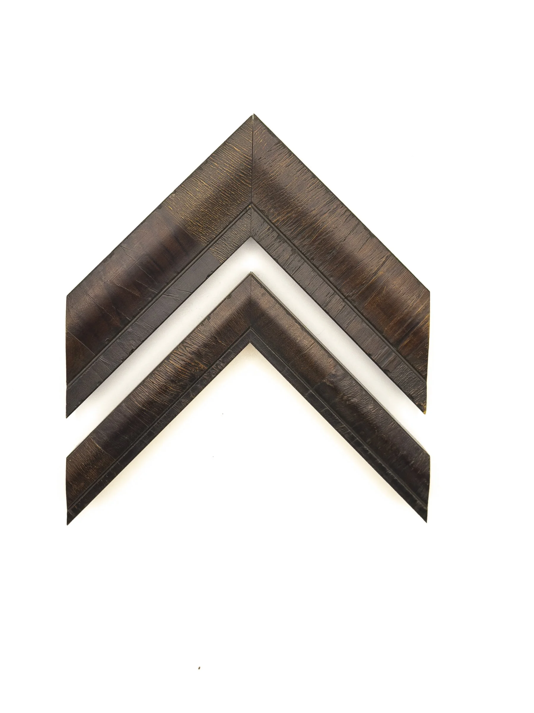 Rich espresso-brown picture frame moulding featuring warm bronze highlights, visible wood grain, and a softly curved profile in wide and narrow options. Available for custom framing in Wichita, KS at Dock 410, these elegant mouldings complement portr