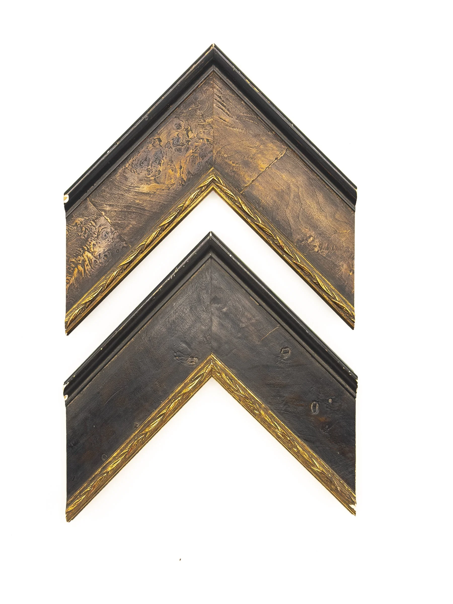 Rustic picture frame moulding with a wide dark brown and charcoal wood-grain profile, black outer edge, and decorative antique-gold leaf detailing along the inner lip. Available for custom framing in Wichita, KS at Dock 410, this distinctive moulding