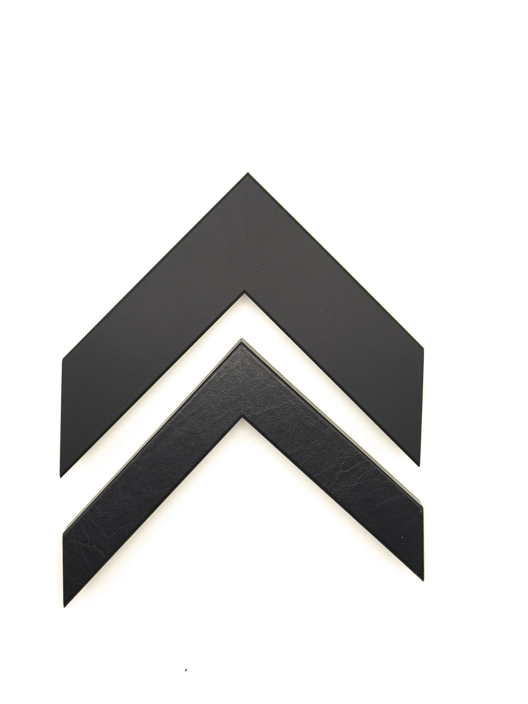 Modern black picture frame moulding available in a wide, smooth matte finish and a narrower textured finish. Offered for custom framing in Wichita, KS at Dock 410, these versatile mouldings are ideal for photography, contemporary art, posters, certif
