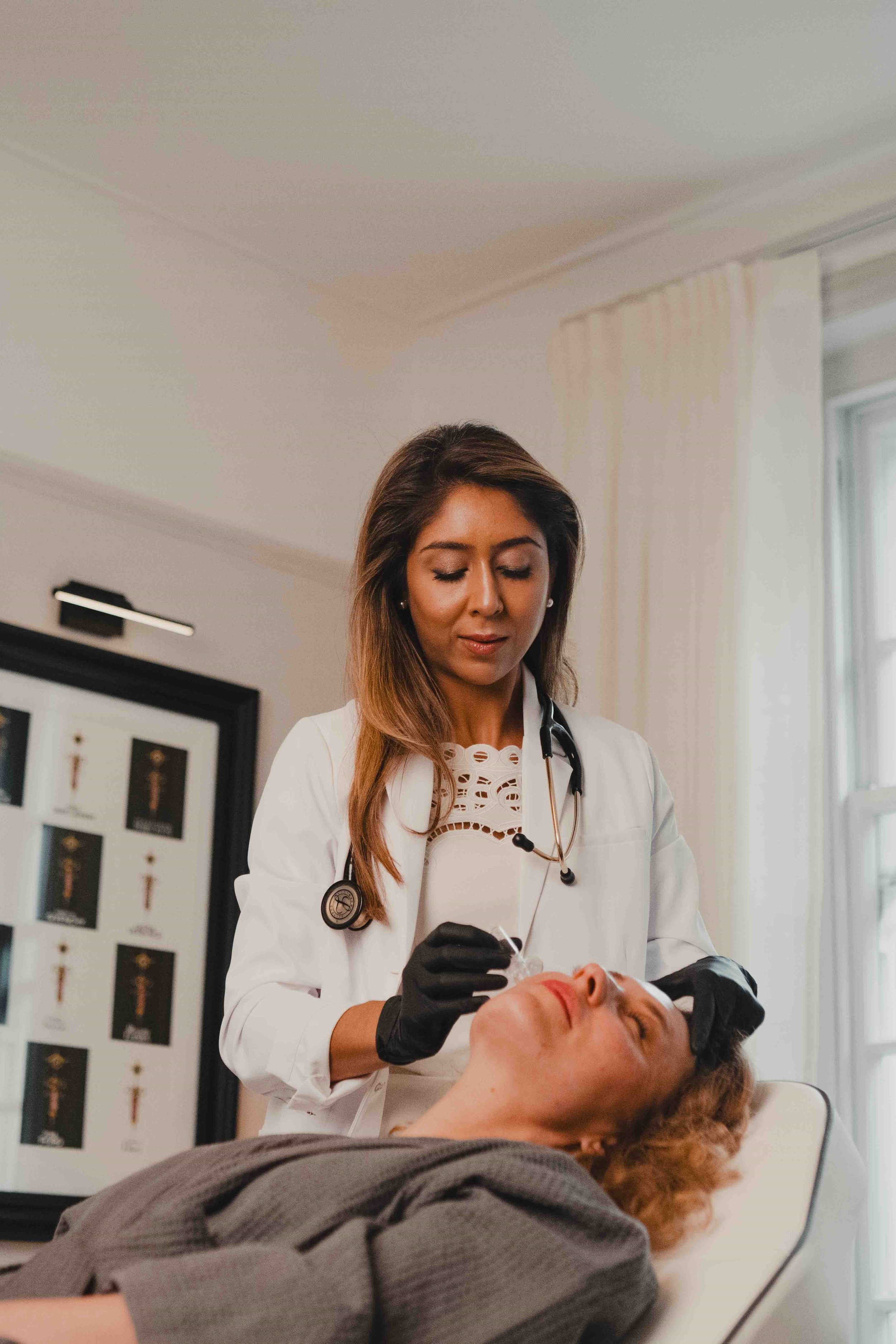Dr Paris administering injectable treatment