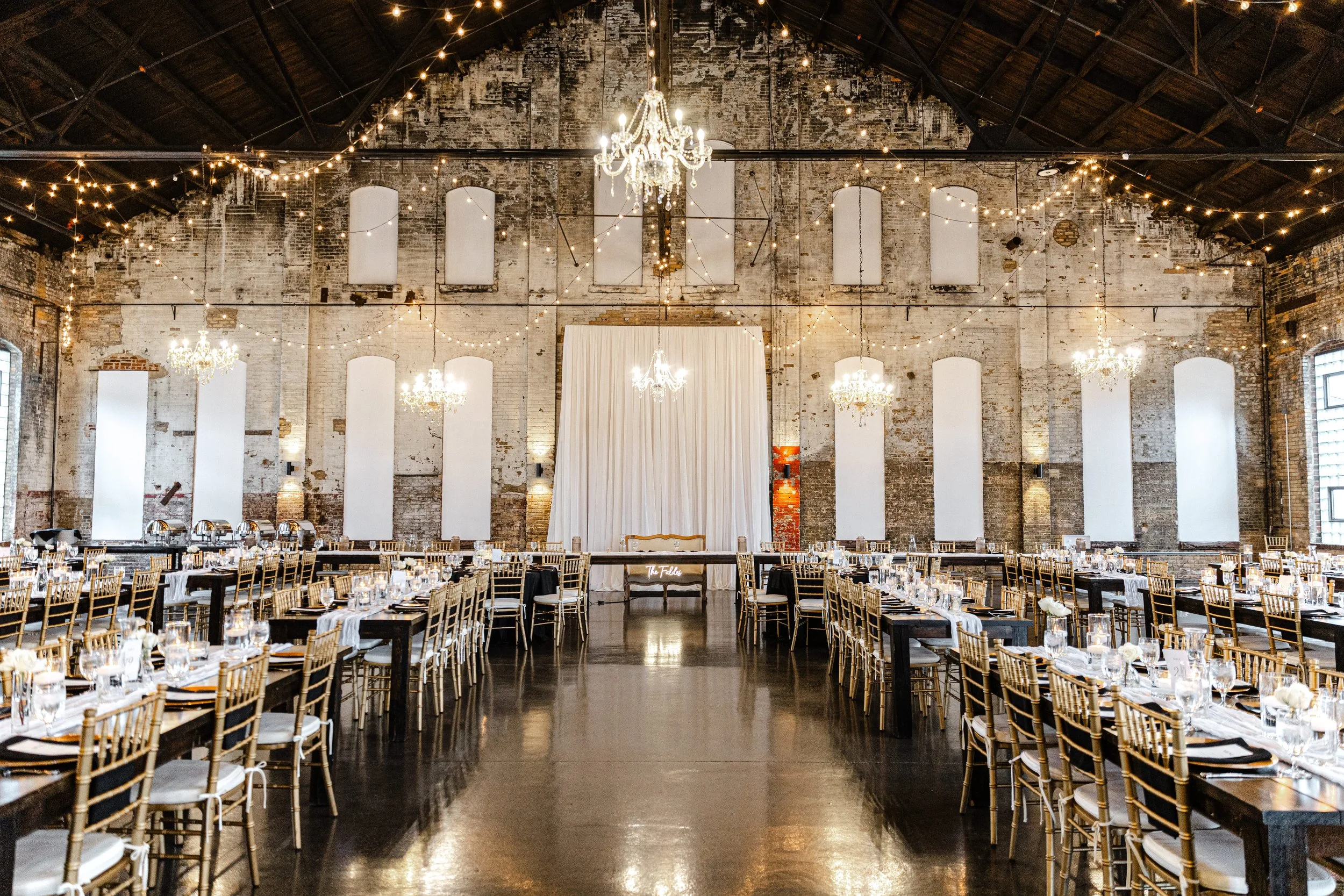 A picture of Blacksmith Main, an industrial wedding venue located at Northern Pacific Center in Brainerd, Minnesota. This elegant space was once a Blacksmith shop for the former repair shop of the Northern Pacific Railway