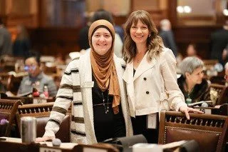 Rep. Anulewicz stands with Rep. Romman.