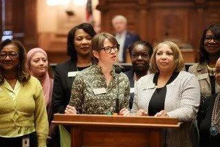 Rep. Anulewicz speaks from the well alongside the Georgia Women's Caucus.