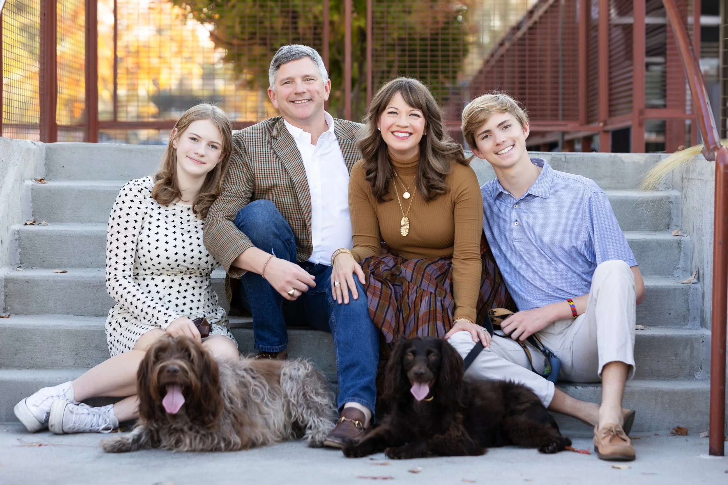 Rep. Anulewicz sits with her husband, two children, and two dogs.