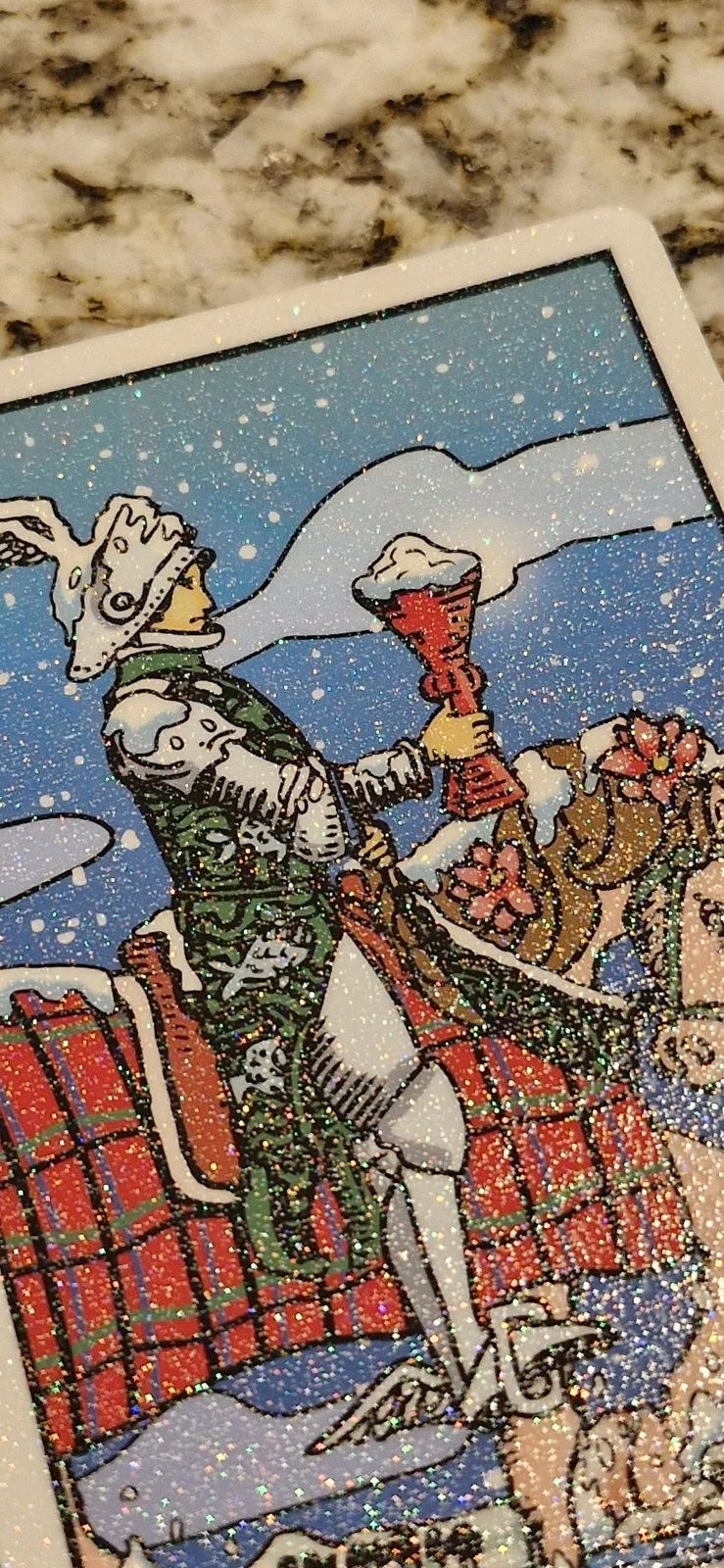 The Knight of Cups from the Winter Waite: Glitter edition tarot deck.