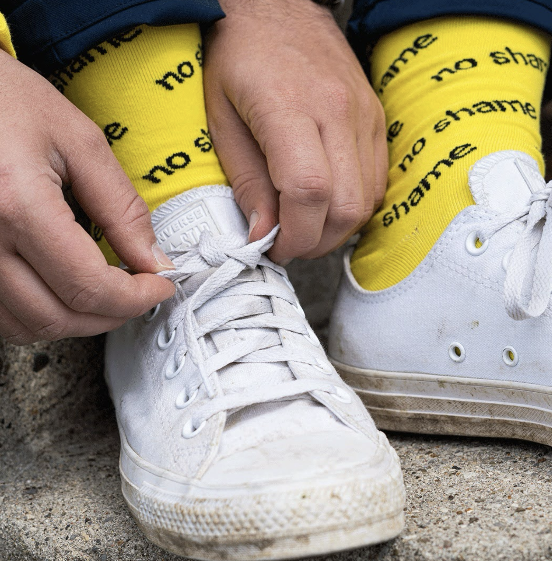No Shame branded yellow socks styled with Converse shoes. (Copy) (Copy)