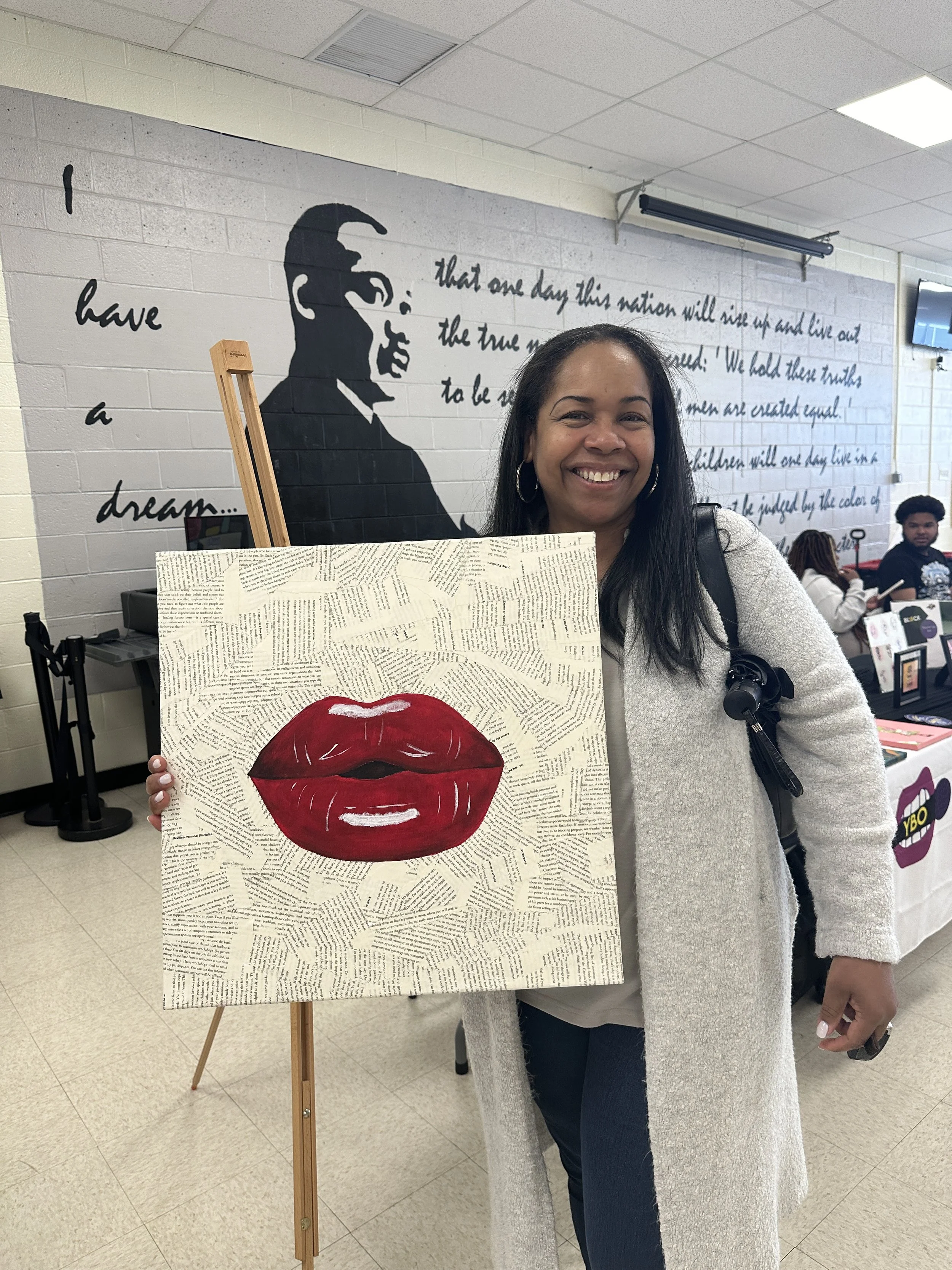 Customer holding purchased mixed media art