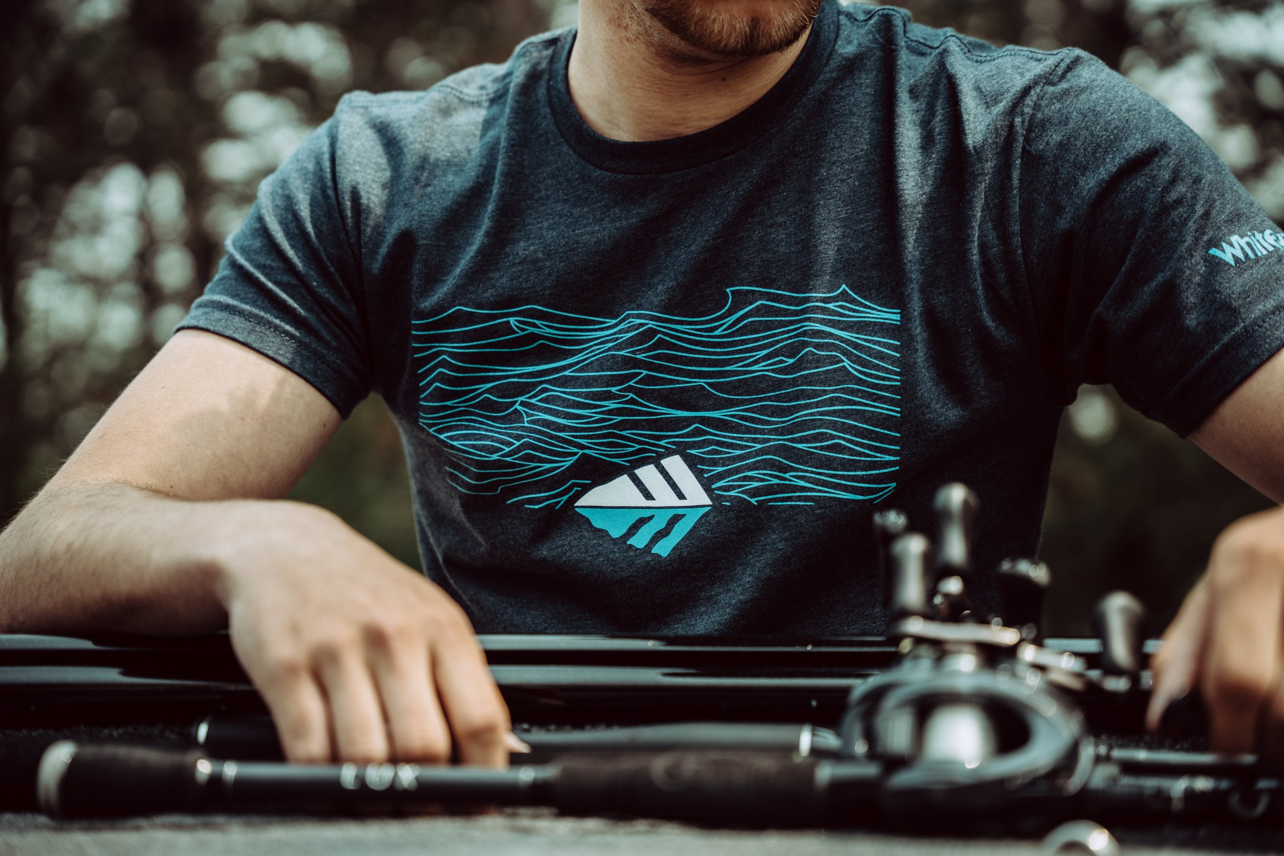 Image of model wearing Whitewater Sketchy Waves Tee (Photo provided by Whitewater Fishing)