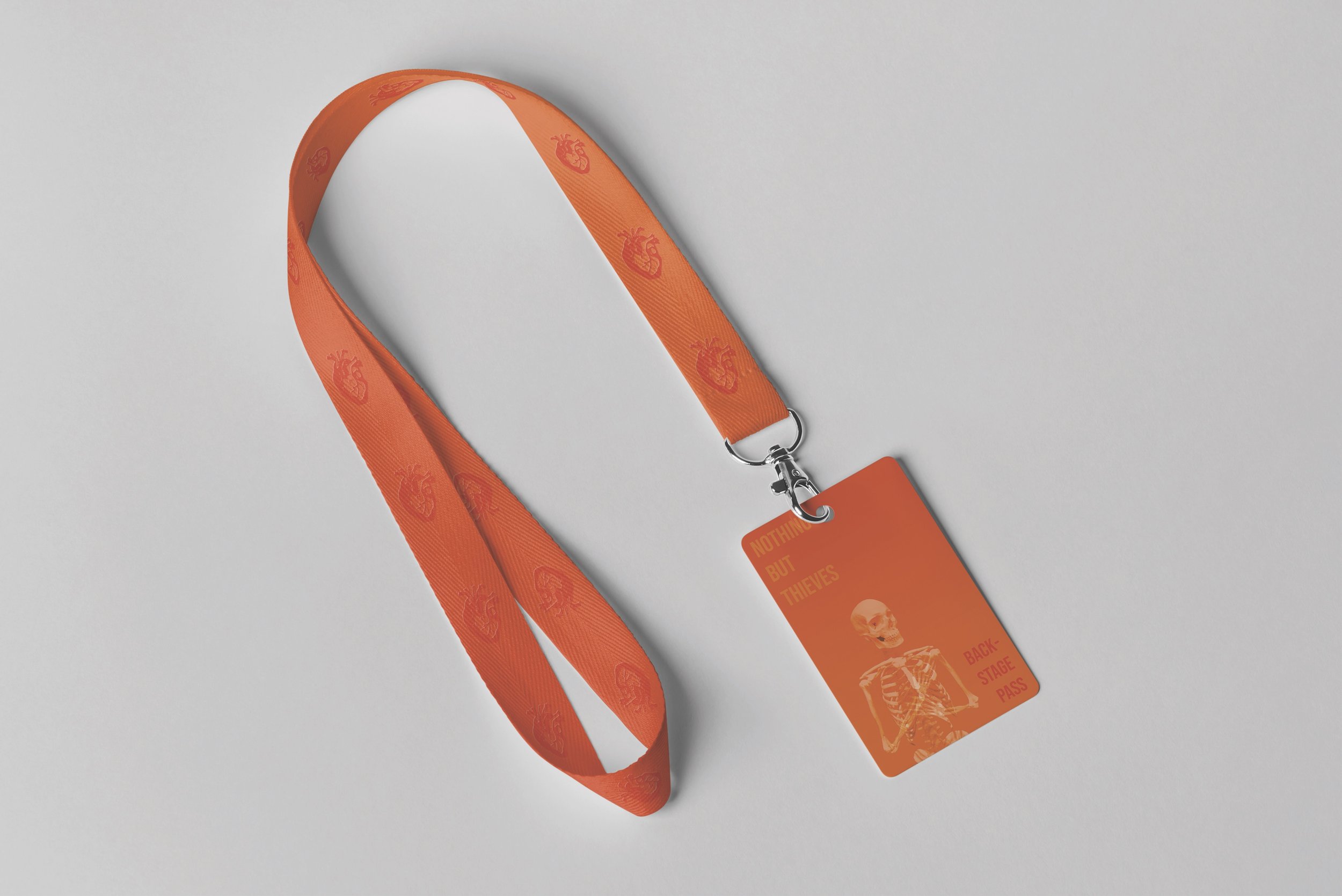 A conceptual backstage pass with realistic hearts on the lanyard and a skeleton on the pass itself