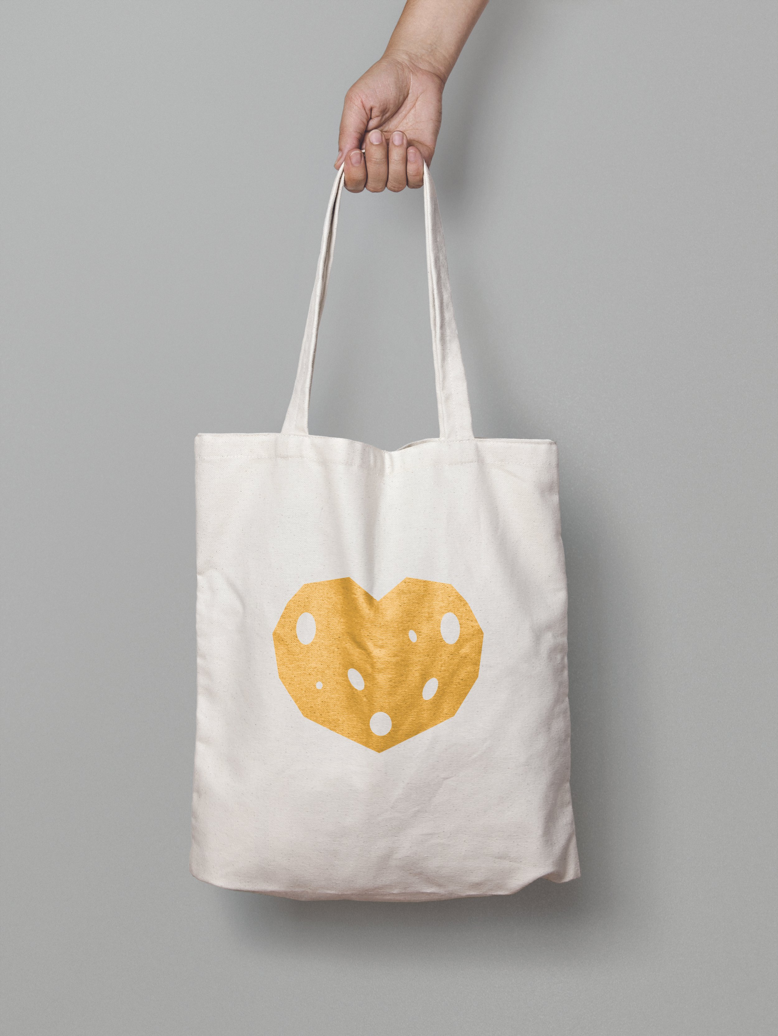 Canvas bag back with a heart of solid gold cheese