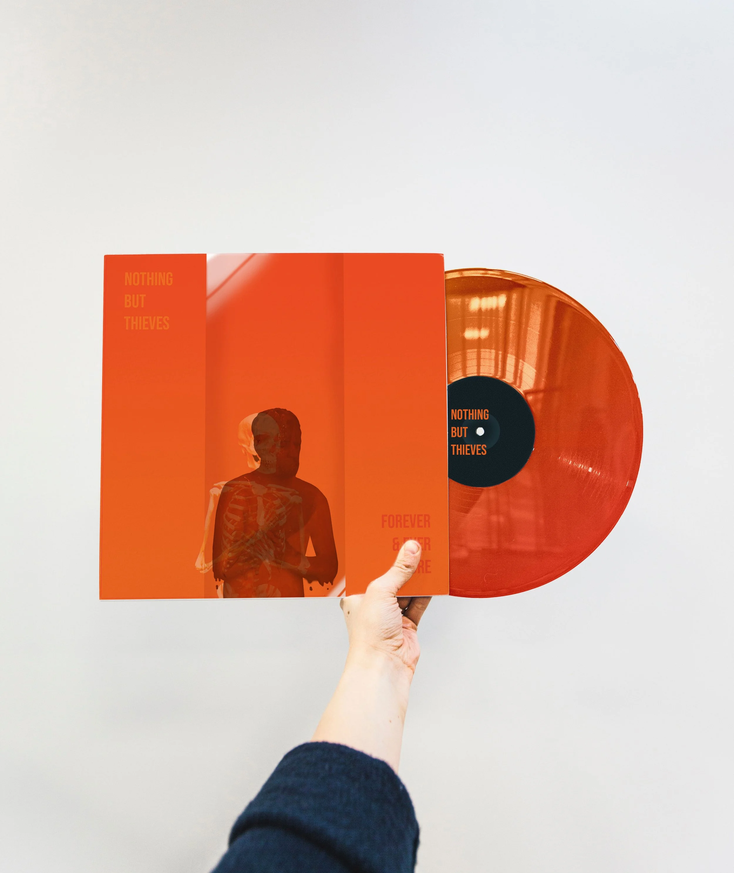 Album cover for Nothing But Thieves with a man melting and holding himself