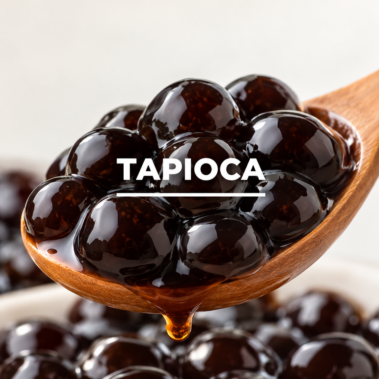 Glossy Tapioca Pearls in Wooden Spoon.png